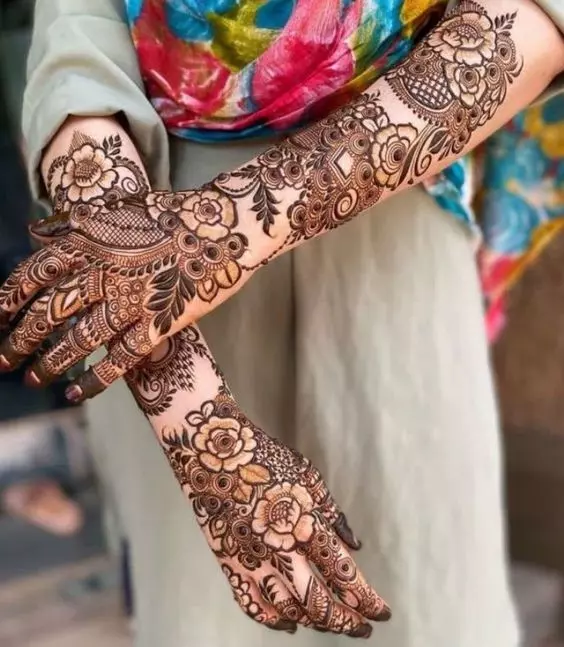 3. Floral Ring Ceremony Mehndi Designs for Engagement Bride
