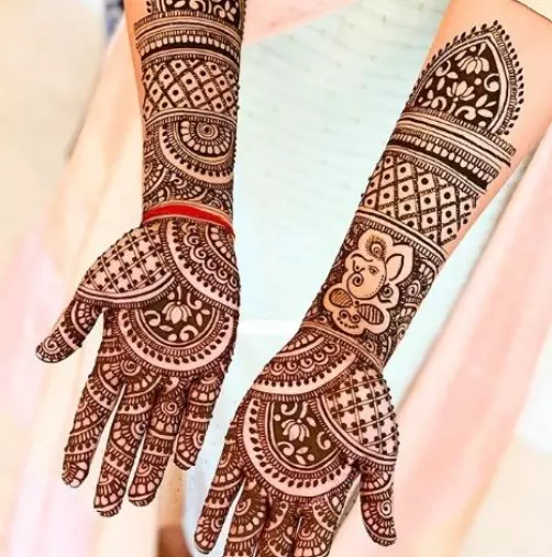 8. Ganesha Ring Ceremony Mehndi Designs for Engagement Bride
