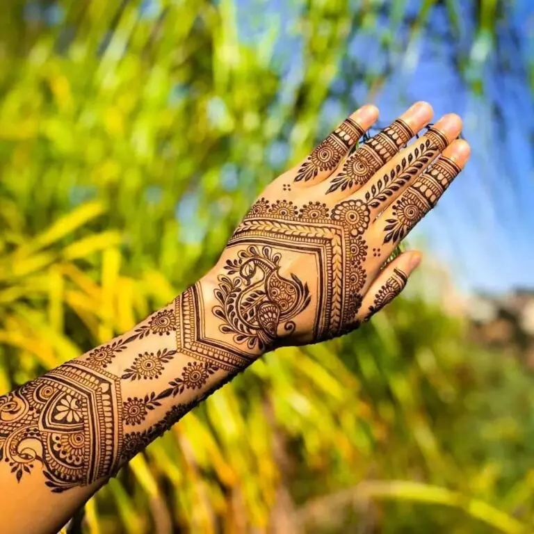 29. Paisley and Peacock Ring Ceremony Mehndi Designs for Engagement Bride