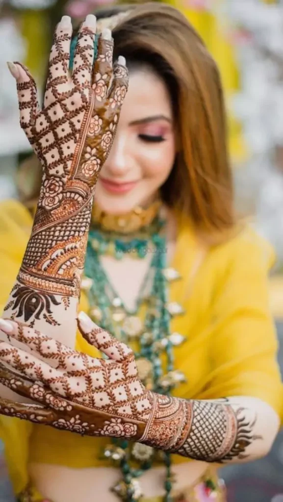 10. Floral + Mesh Bridal Back Hand Mehndi Designs 10. Floral + Mesh Bridal Back Hand Mehndi Designs