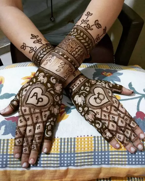 4. Initials Bridal Back Hand Mehndi Designs 4. Initials Bridal Back Hand Mehndi Designs