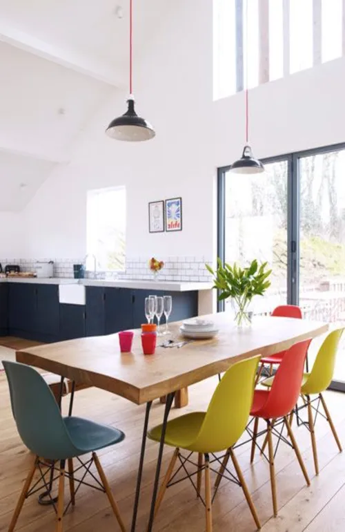 Wooden Table With Coulourful Chairs